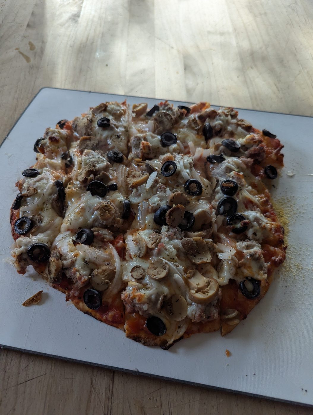 Baked Hup's-style pizza, bubbly and browned, fresh from the oven