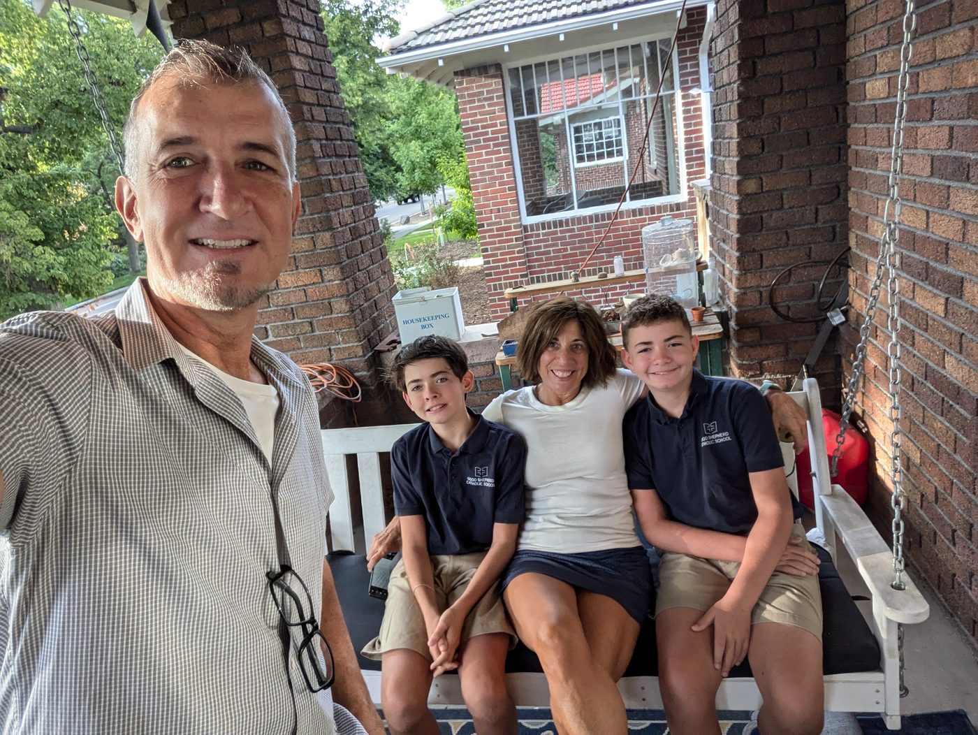 Family sitting on a porch swing